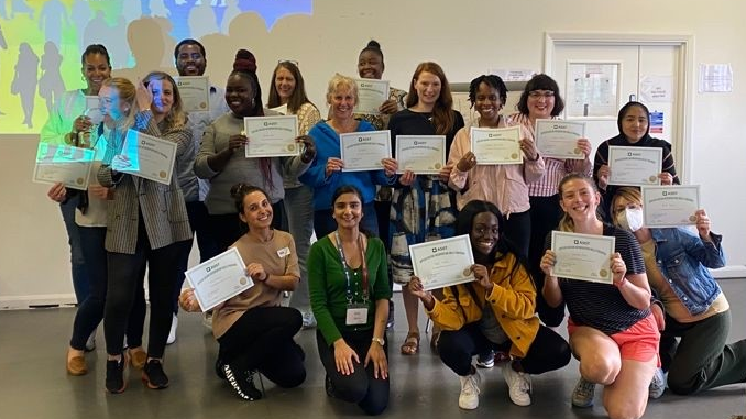 Participants celebrate at the end of their accredited ASIST (phase 3) two-day training course through the Suicide Safer Schools programme.